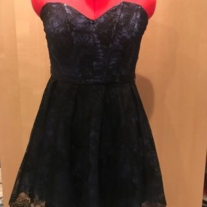 Elegant purple satin dress with black lace overlay